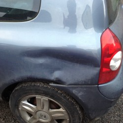 Renault Clio with a Large Dent in N/S 1/4 Panel